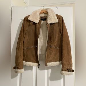 Lucky Brand 100% leather and faux fur trim jacket in women’s size large.